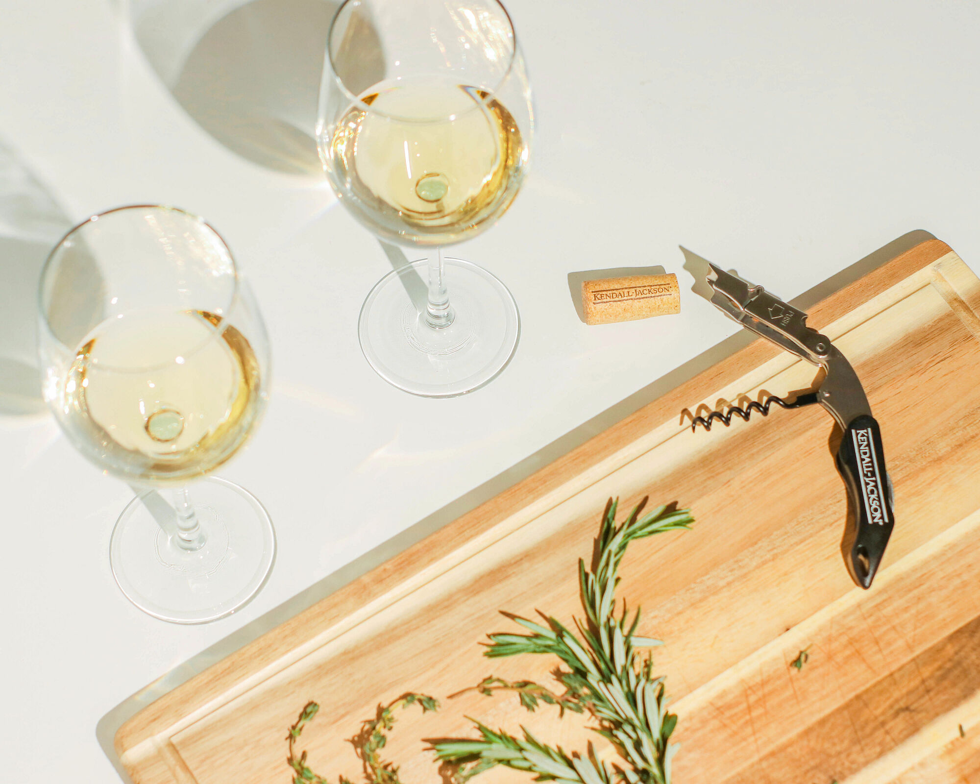 Kendall-Jackson white wine and a cutting board