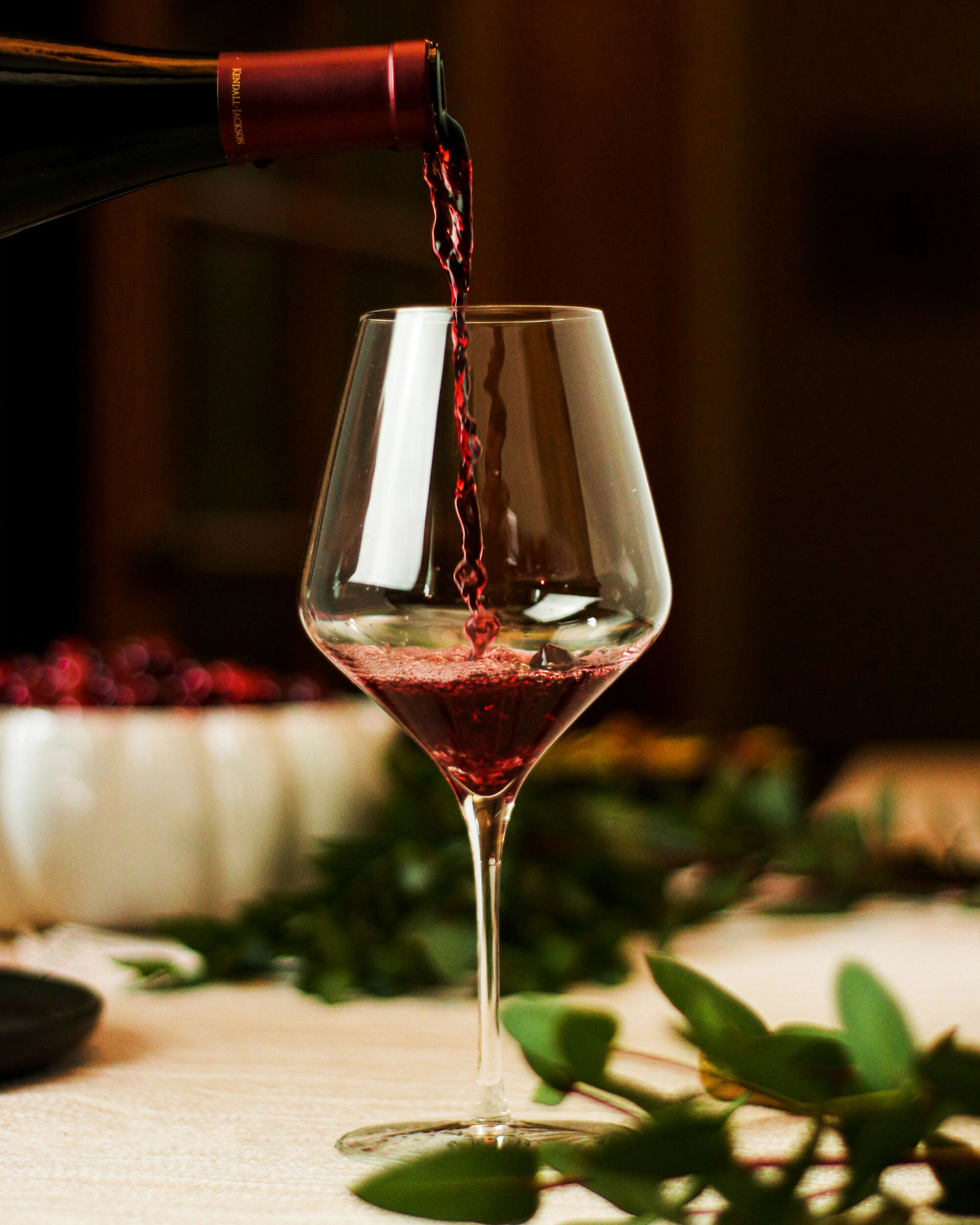 Pouring red wine in a glass