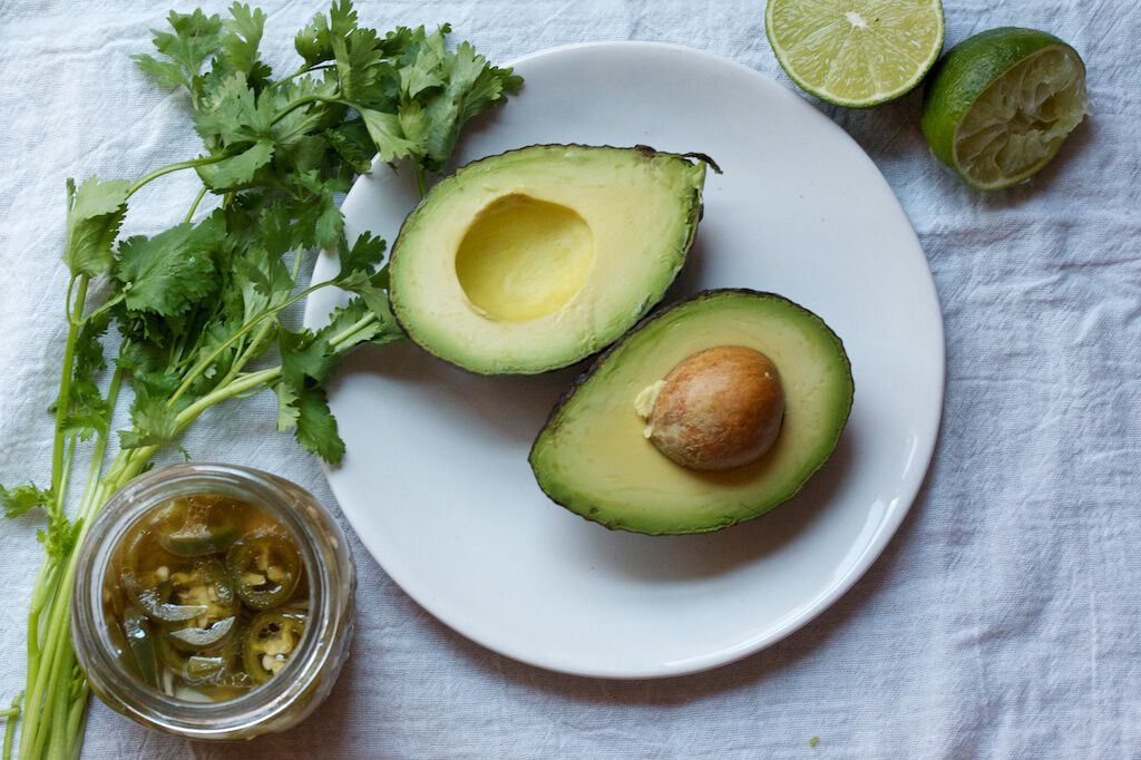 Sliced avocado with cilantro Sliced avocado with cilantro