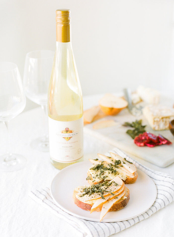 Riesling wine served with a pear, brie, sage crostini