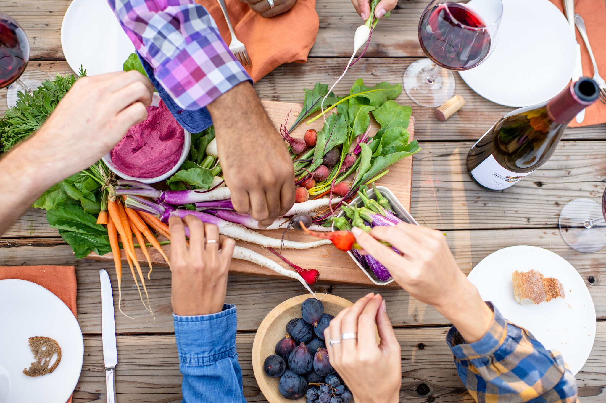 Pinot Noir on a table with vegetables and fruit
