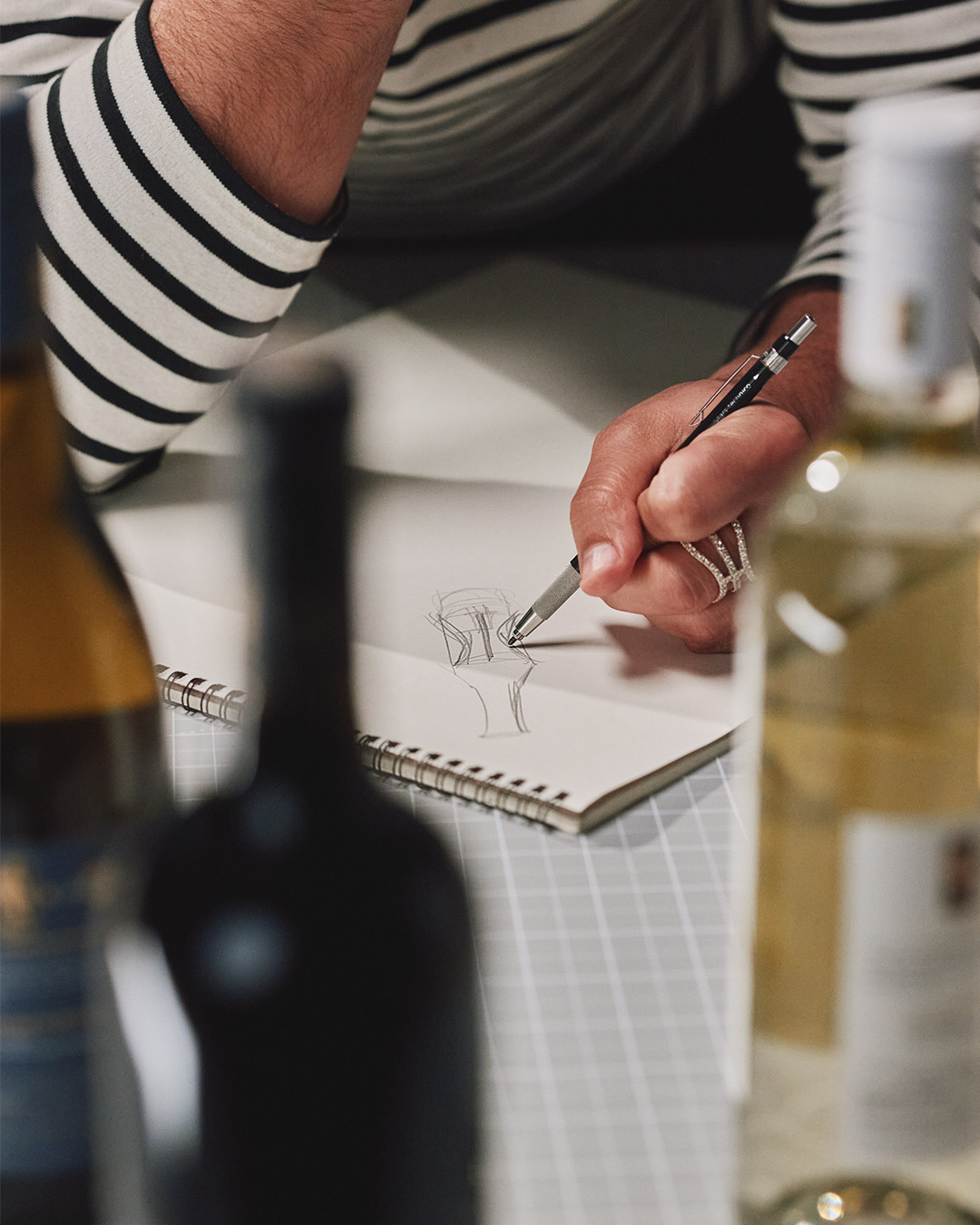 Behind the scenes close up sketch of K-J x NBA Wines bottle