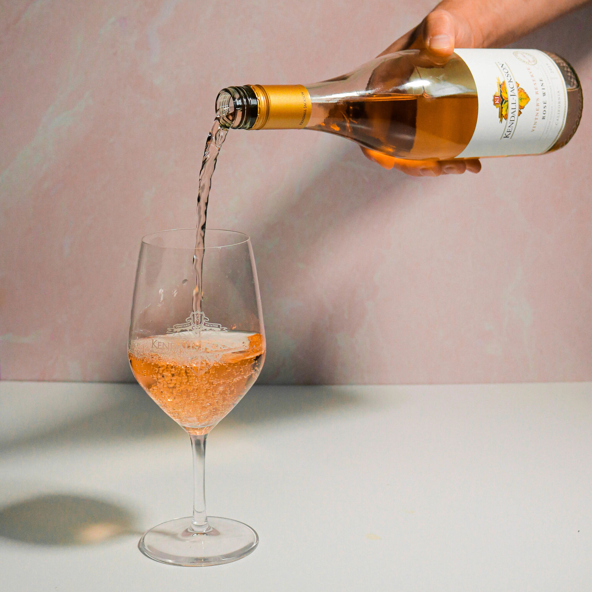 Rosé wine pouring