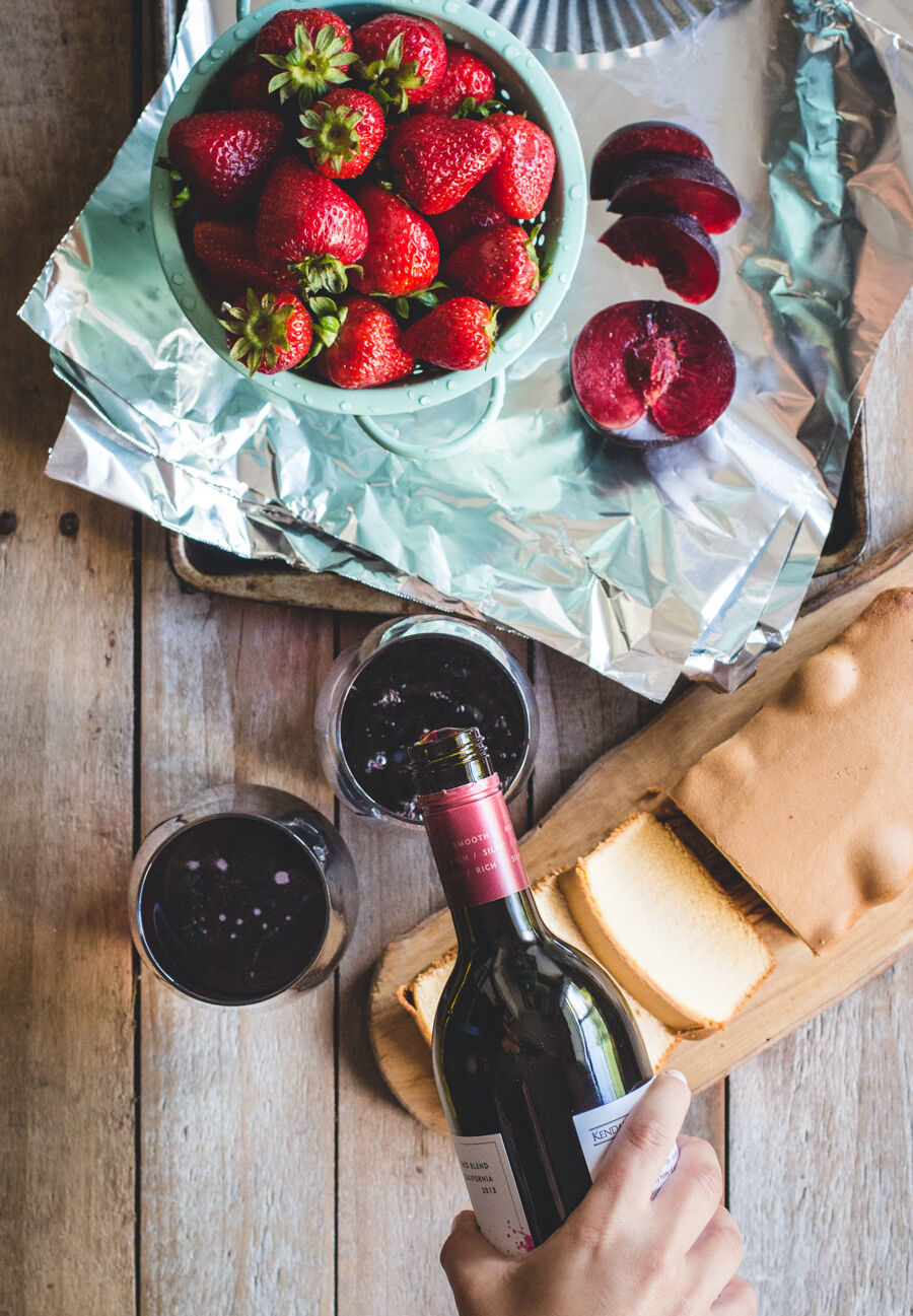 Pouring wine with pound cake and fruit