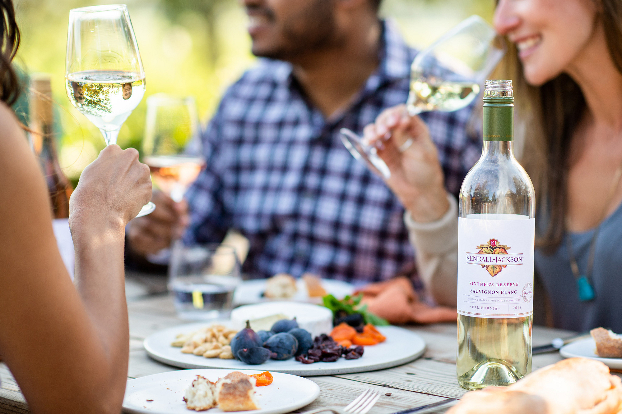 Friends enjoying Sauvignon Blanc wine with food