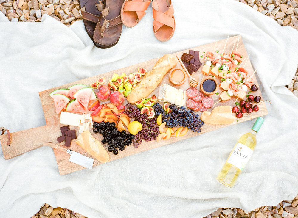 Melon and Prosciutto Skewers with a charcuterie board
