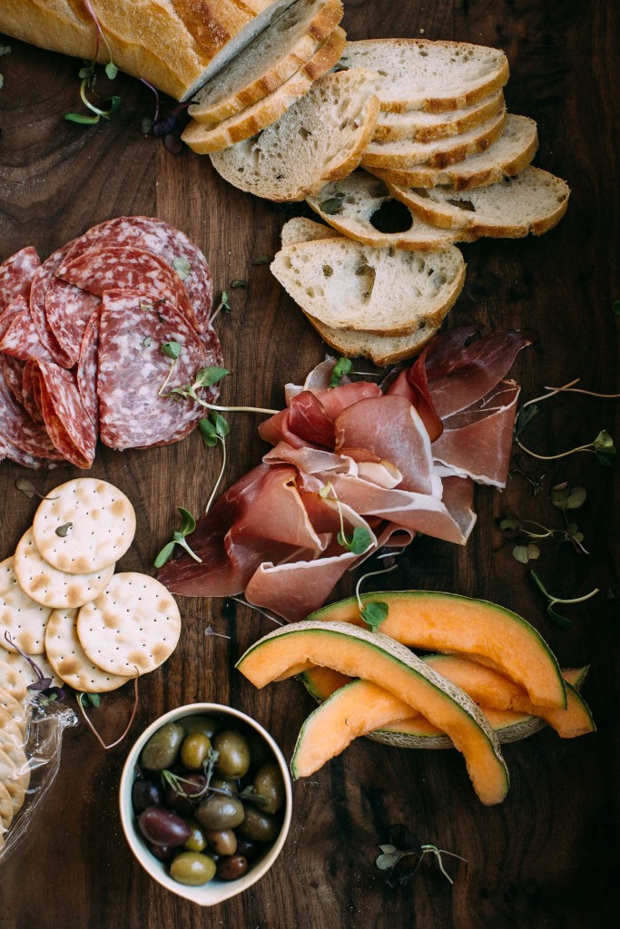 I adore antipasto platters because they allow you to be infinitely creative without spending all day in the kitchen. Plus, with a big crowd, you can set up a few platters at the table and at the bar, maybe one on the coffee table, even, to create more intimate settings for conversation.