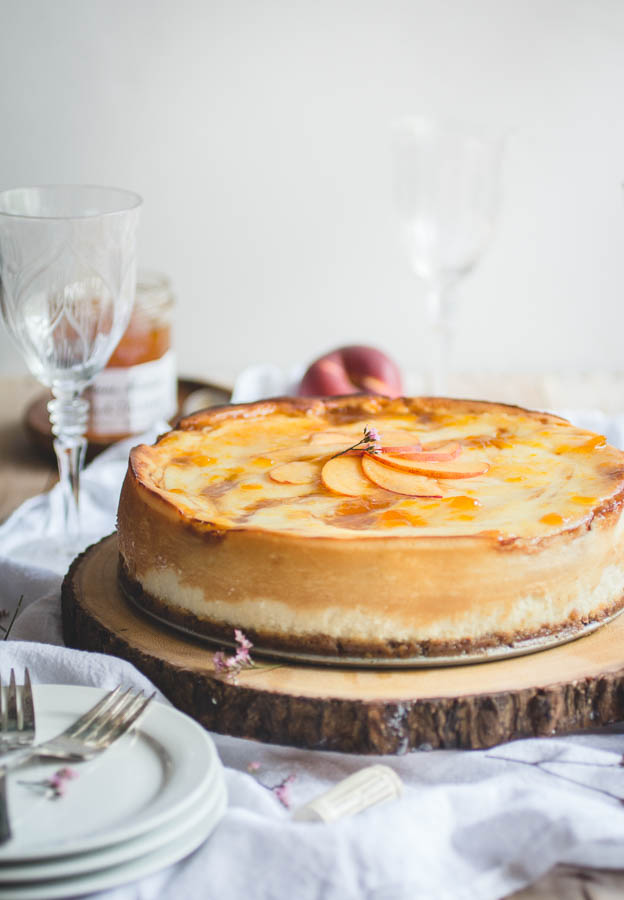 For this recipe, I’ve taken my favorite New York-style cheesecake and layered it with spiced peach compote to bring out the notes of peach in the wine. And since peaches and pecans compliment each other so perfectly, I added pecan pieces to an otherwise traditional graham cracker crust for a little bit of southern flair and added texture.
