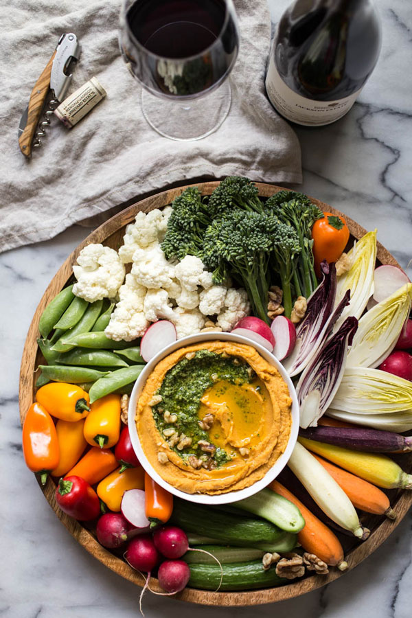 This sweet potato hummus with kale pesto &amp; fall crudités recipe is not only seasonal and delicious, but also simple to pull together.